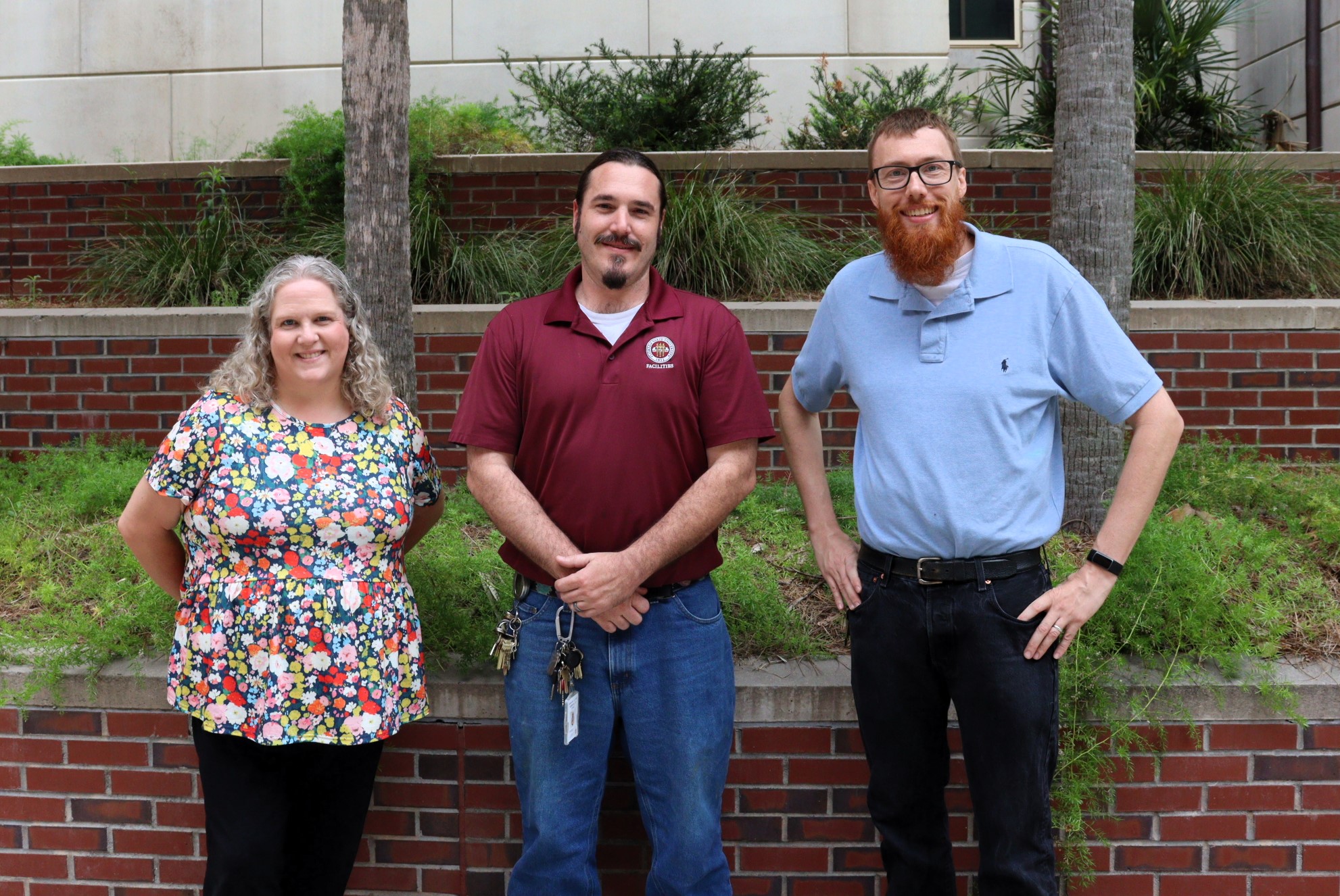 Assistant Director of Operations Lacey Southwick, Maintenace Supervisor Zale Bergozza, and Director of Operations Dr. Steve Kleuver outside of Ragans Hall
